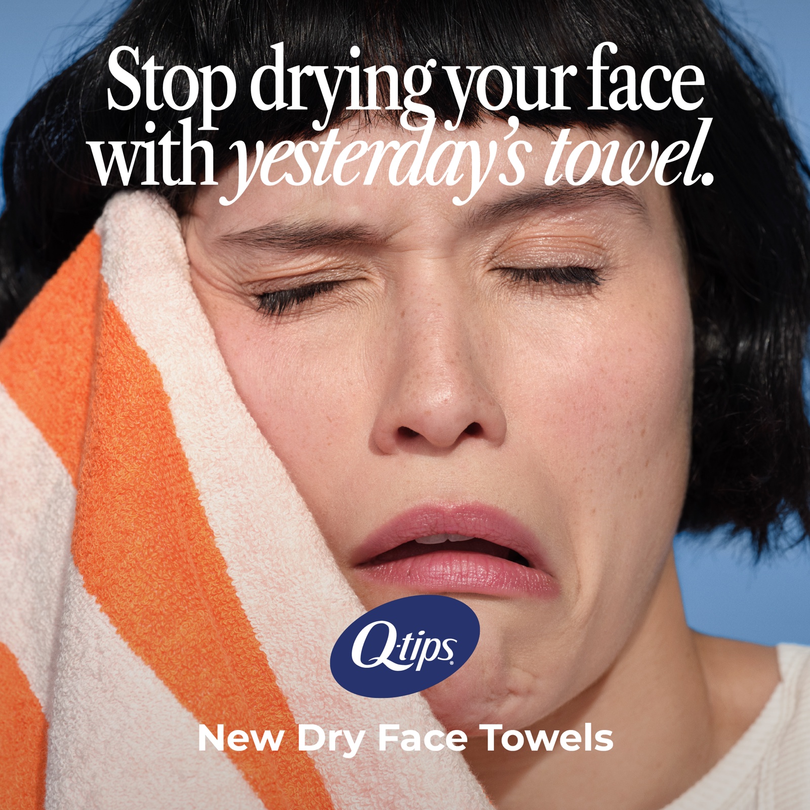 Social post of a grimacing woman pressing a striped towel to her face under "Stop drying your face with yesterday's towel."